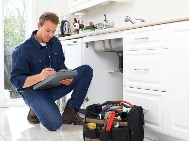 working on garbage disposal repair